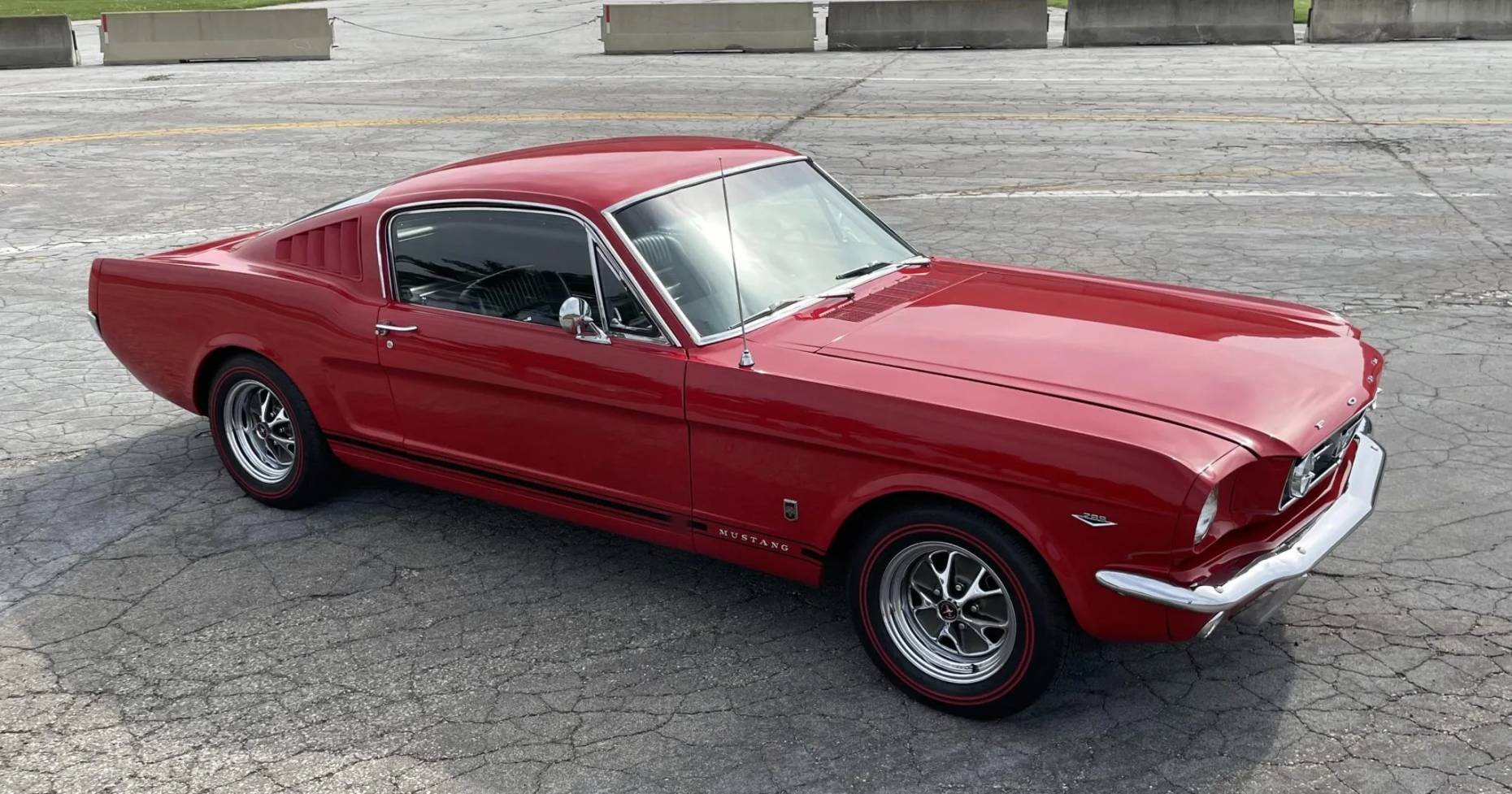 High angle right front 3q view of a red 1966 Ford Mustang fastback